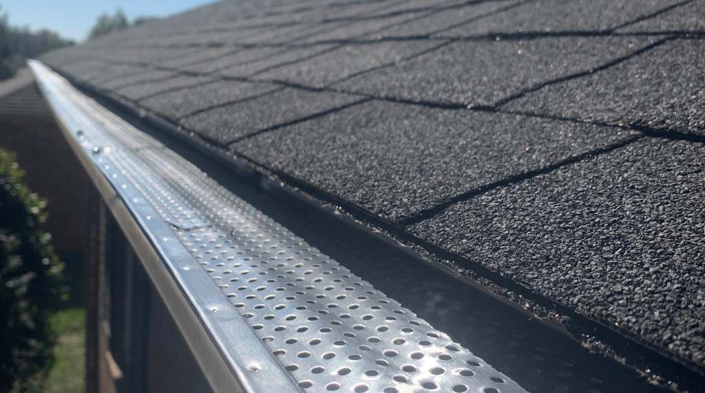 Aluminum gutter guard system installed on residential roof in South Central Tennessee