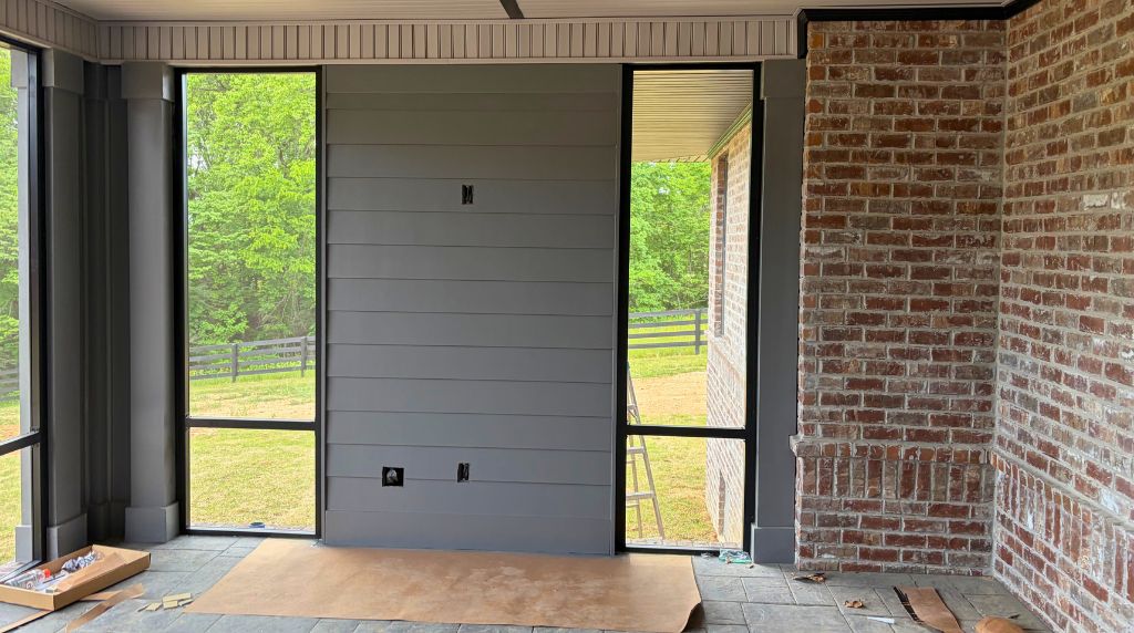 Modern aluminum screen room entryway with screened door system and covered patio enclosure for outdoor comfort