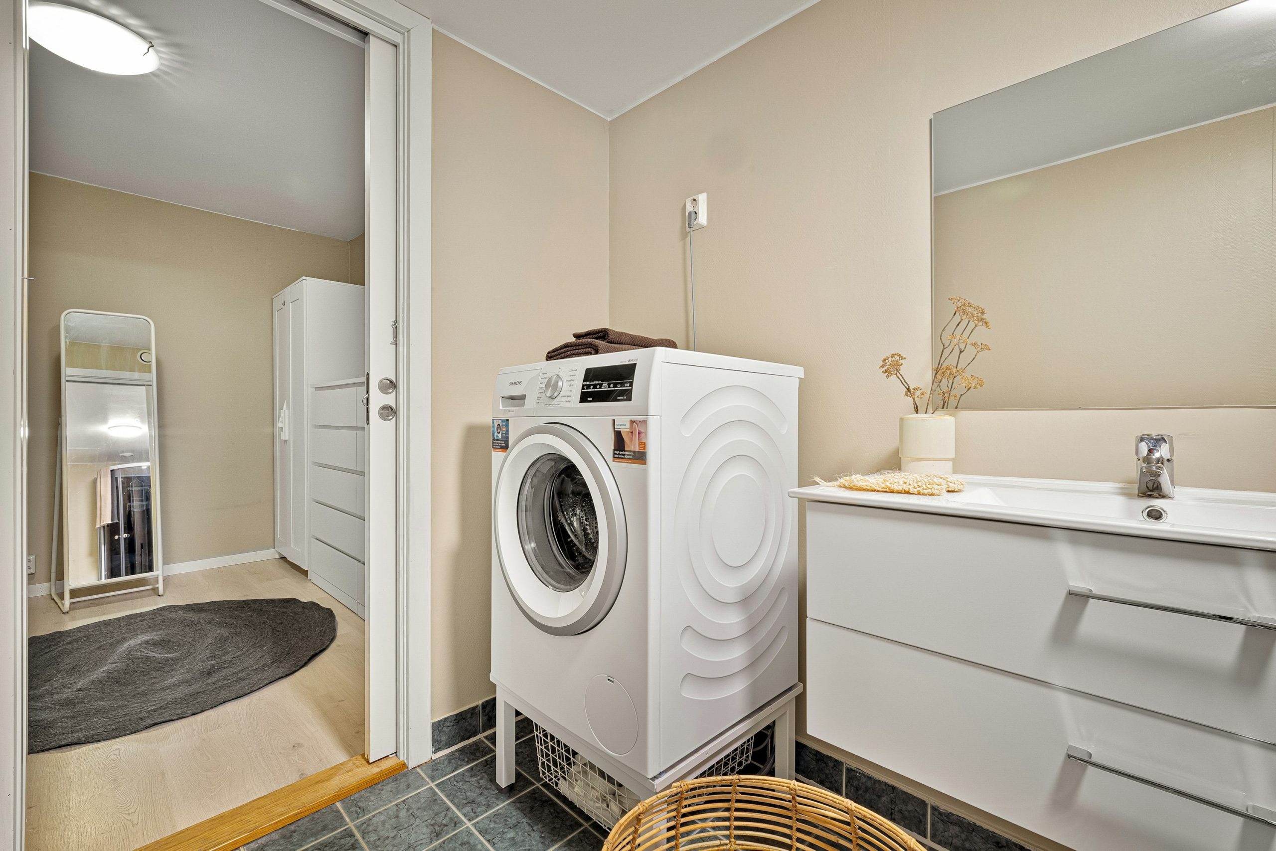 Home warranty plans image of a washer and dryer in a laundry room.